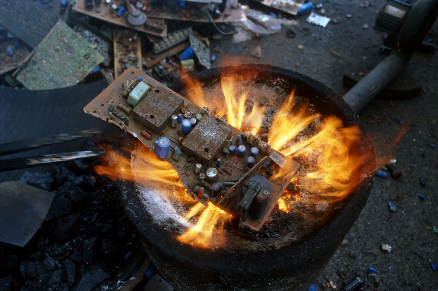 Electronic circuit board burned to salvage metal. Image: Basel Action Network